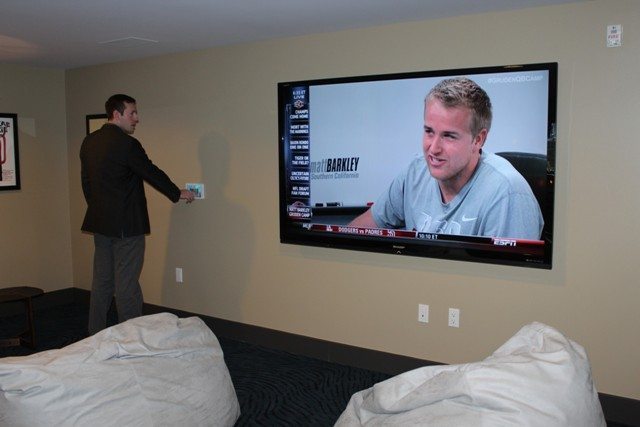 Max, a 6'3 sales associate at Hue, next to the 80-inch flat screen television