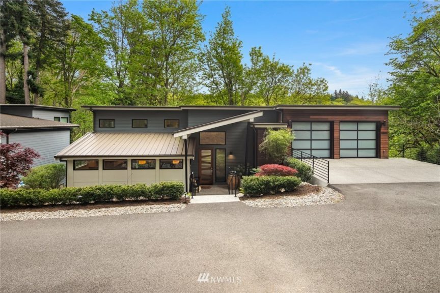 Built in 2017, this wooded contemporary retreat in Kirkland is nestled among the trees on a quite street in the Forbes Creak area